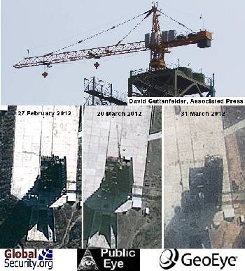 Details of the gantry in satellite imagery are hard to distinguish. Viewed up close, the crane is consistent with those found the world over.